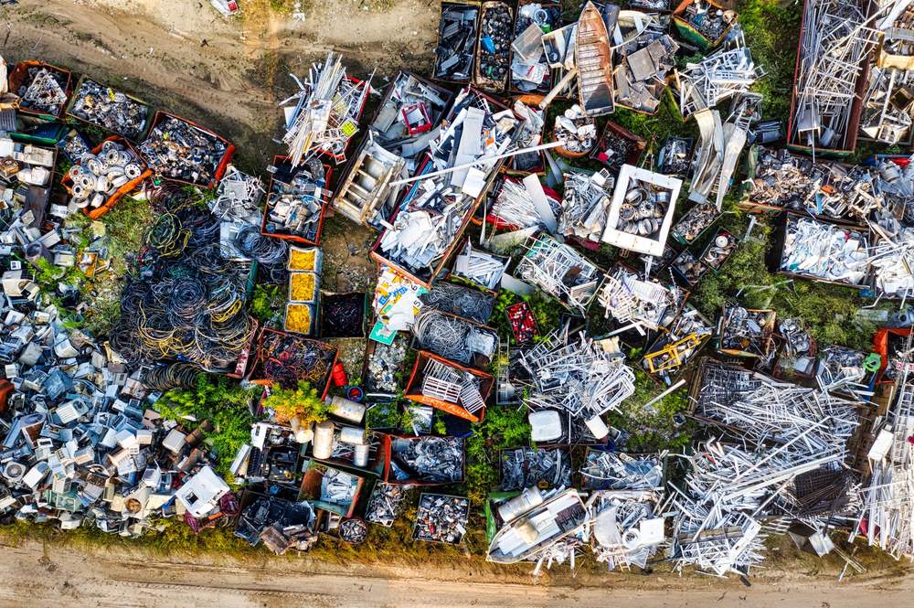 Sorted scrap metal and cardboard ready for recycling