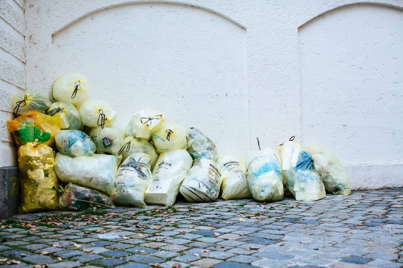 Bagged household waste stacked for pickup